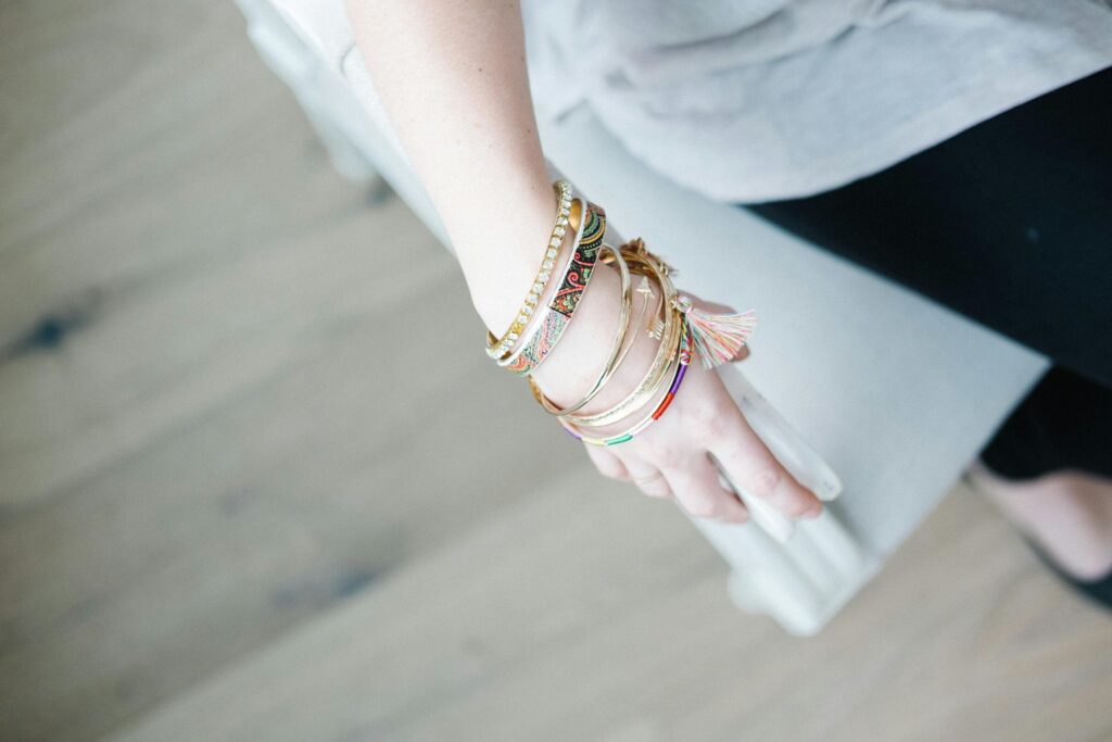 A stylish display of colorful bangles on a woman's arm, exuding fashion elegance.